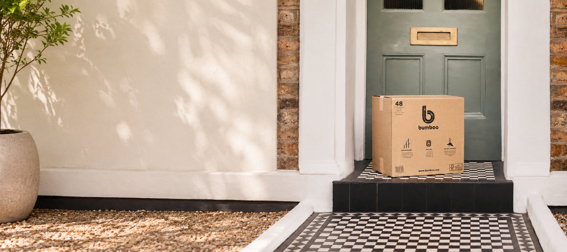 Cardboard box with a bumboo logo on a doorstep