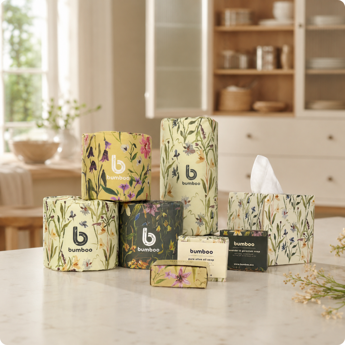 Bumboo brand products including candles, soap, and tissue paper with floral designs on a kitchen counter.