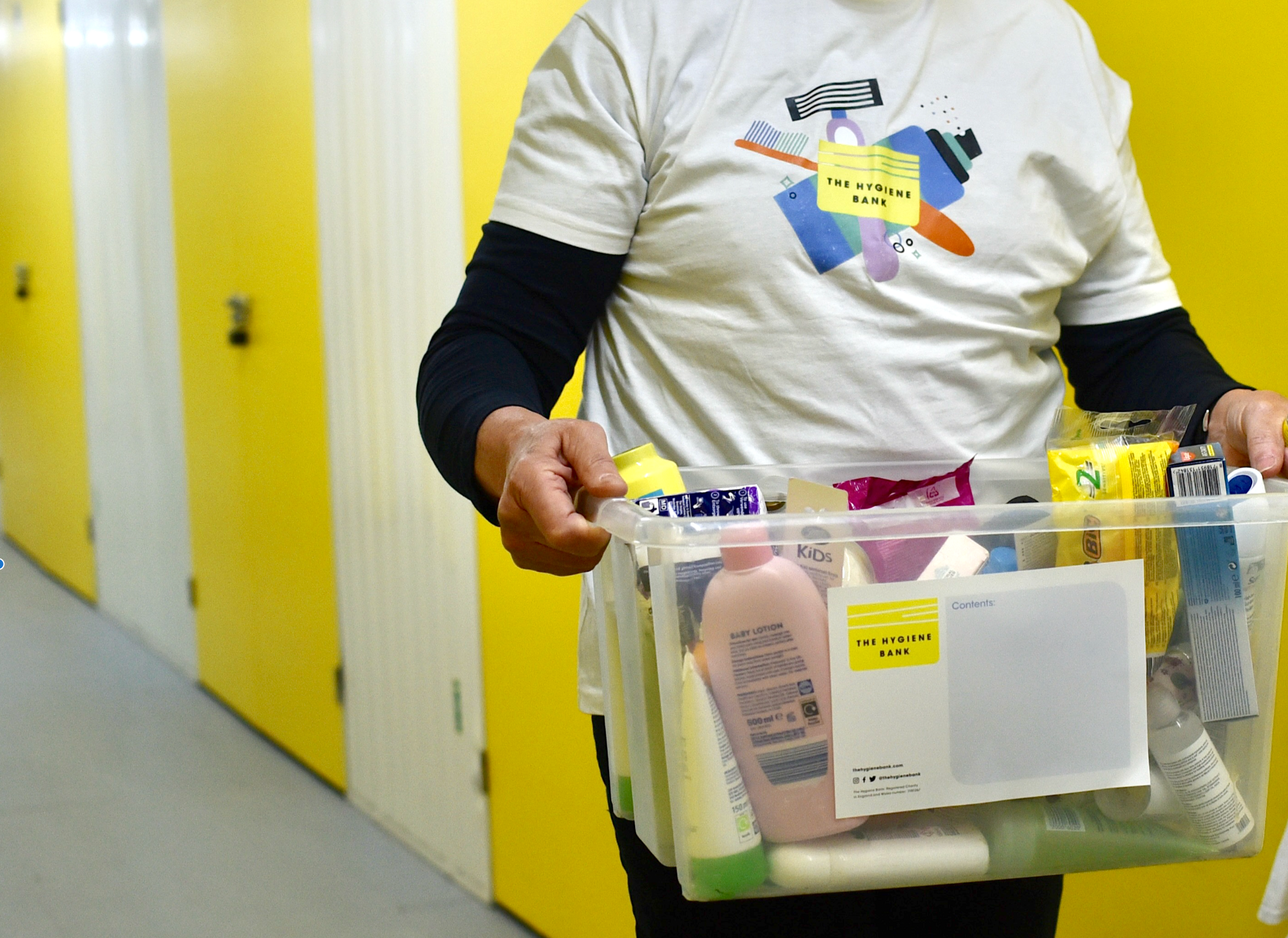 Person carrying donated products to give to charity