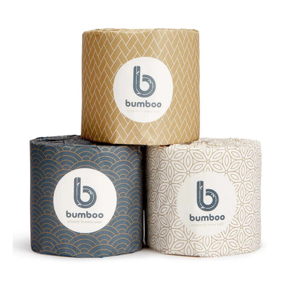 Three rolls of bamboo toilet paper with patterned packaging on a white background