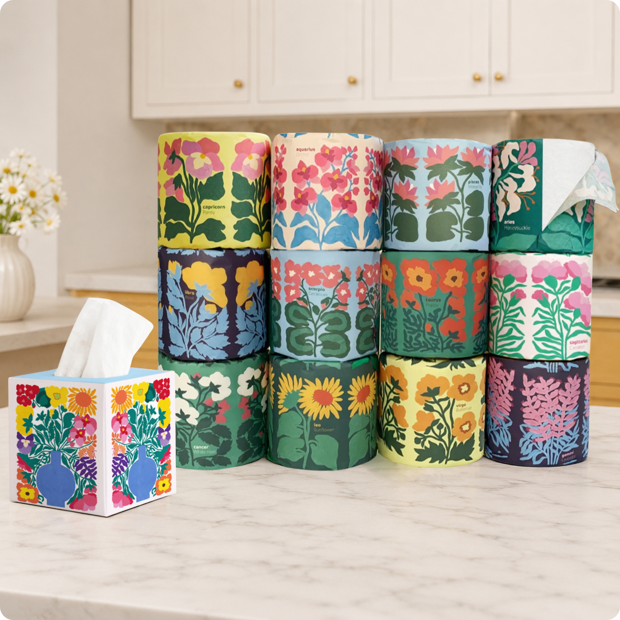 Stack of floral-patterned tissue paper rolls and facial tisses on a kitchen counter.