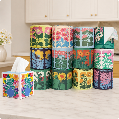 Stack of floral-patterned tissue paper rolls and facial tisses on a kitchen counter.
