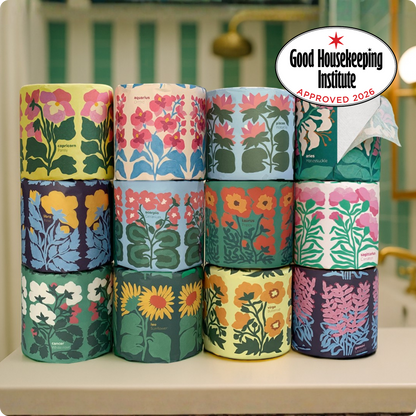 Stack of floral-patterned paper rolls with Good Housekeeping Institute approval badge.