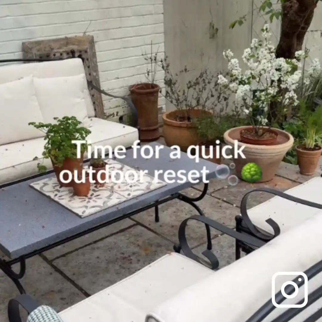 Outdoor patio with furniture, plants, and text overlay 'Time for a quick outdoor reset'.