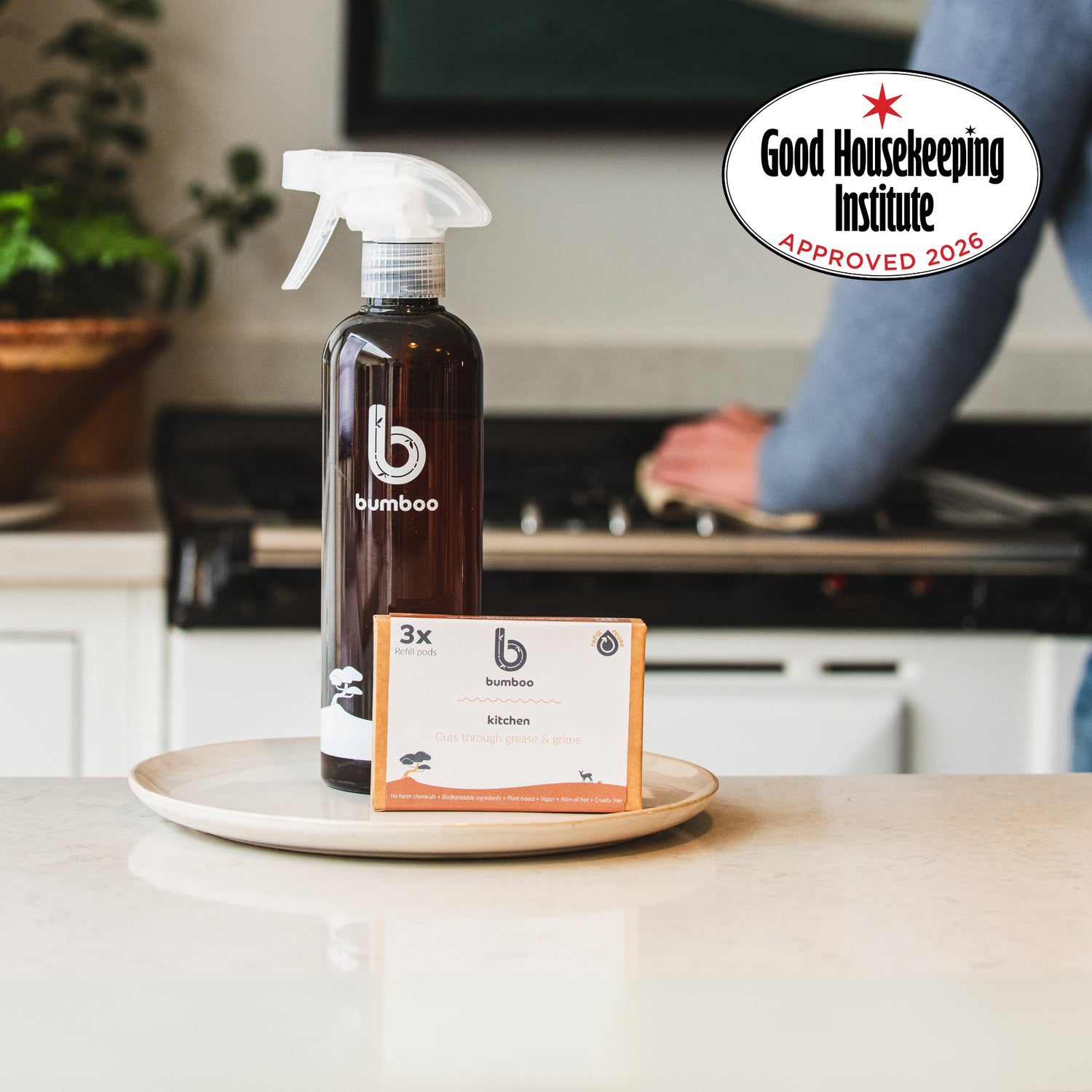 Bamboo brand cleaning spray bottle on a kitchen counter with Good Housekeeping Institute approval badge.