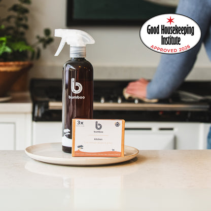 Bamboo brand cleaning spray bottle on a kitchen counter with Good Housekeeping Institute approval badge.