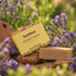 Bumboo soap bar with packaging in a natural setting with lavender flowers