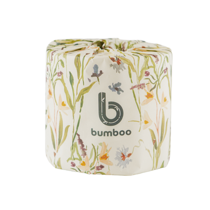 Bumboo brand toilet paper roll with floral design on a white background