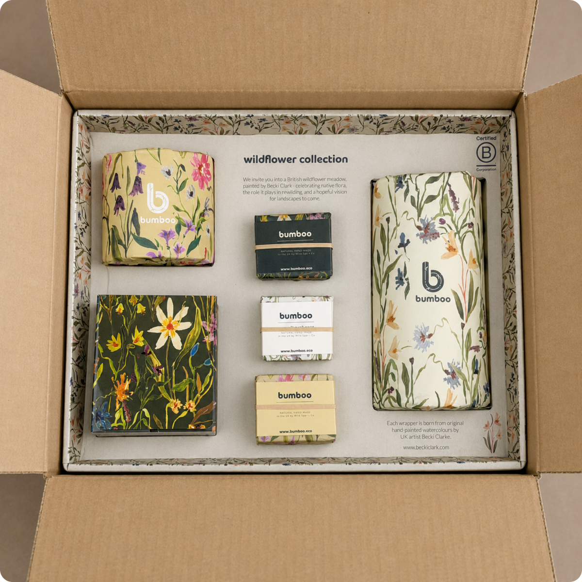 Open cardboard box containing the 'wildflower collection' by Bamboo with floral designs and brand logo.