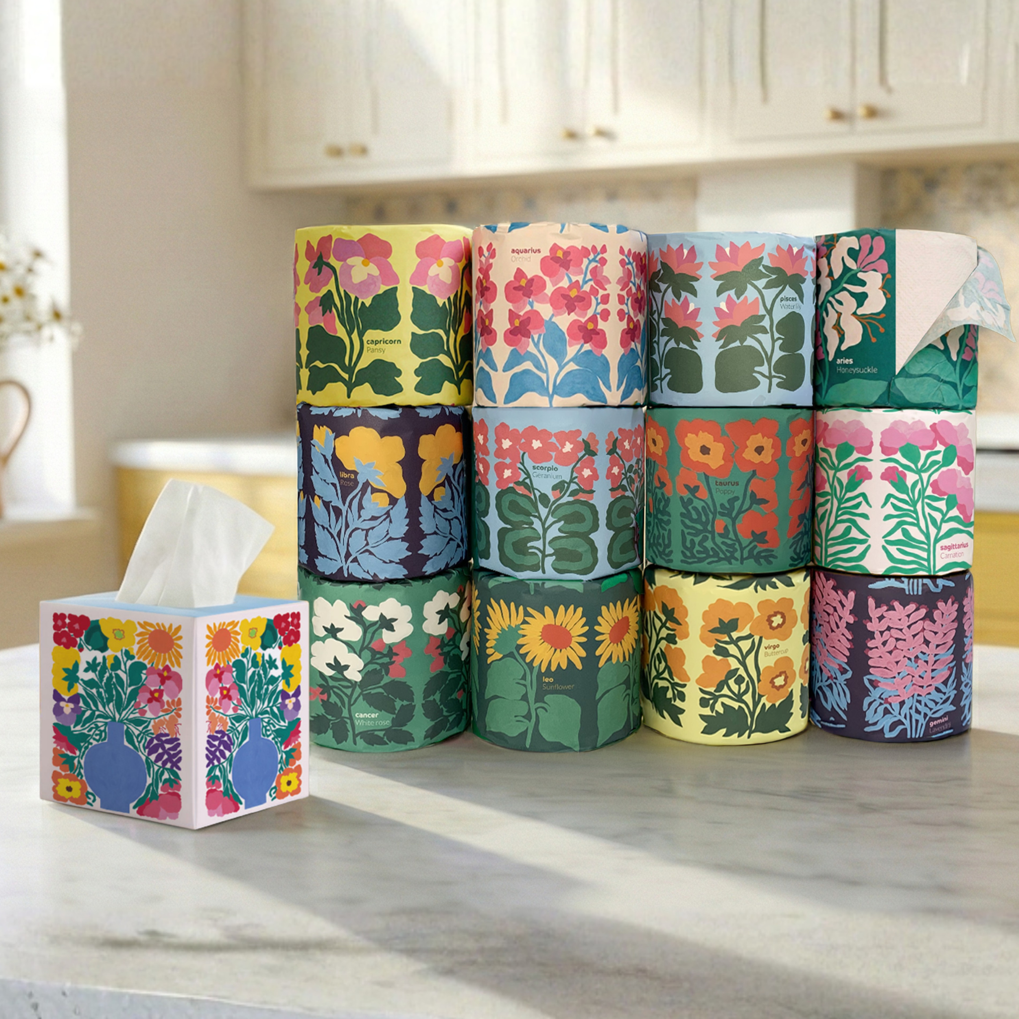 Stack of floral-patterned toilet paper rolls on a kitchen counter.